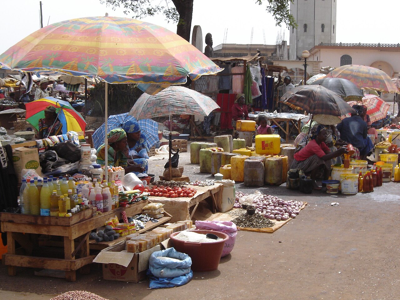Colourful umbrellas shading market stalls in Foumban